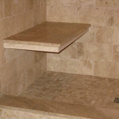 Custom travertine bench in shower
