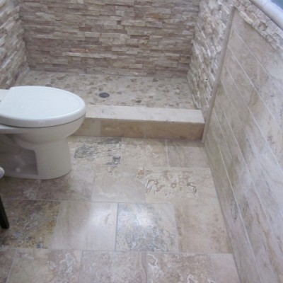 Ledgerstone bathroom with travertine floor