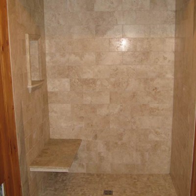 Travertine with bench in shower