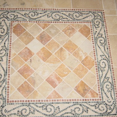 Yellow travertine with mosaic border floor